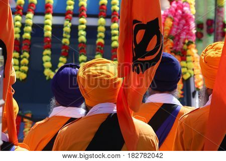 Men In Orange Dress During A Sikh Event