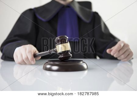 Mallet in the hand of the judge. Law concept.