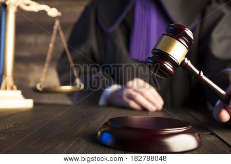 Mallet in the hand of the judge. Law concept.