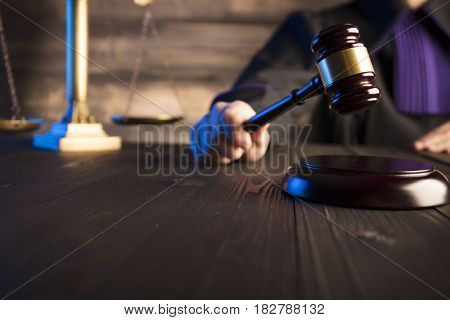Mallet in the hand of the judge. Law concept.