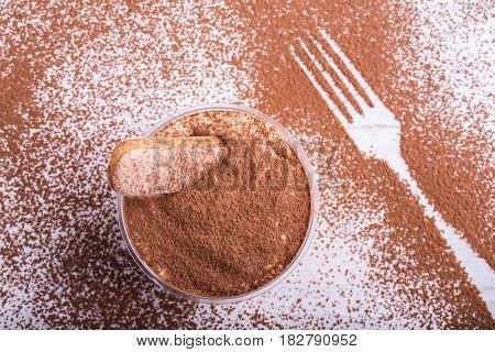 Tiramisu on the basis of mascarpone cheese with savayarda cookies in coffee impregnation