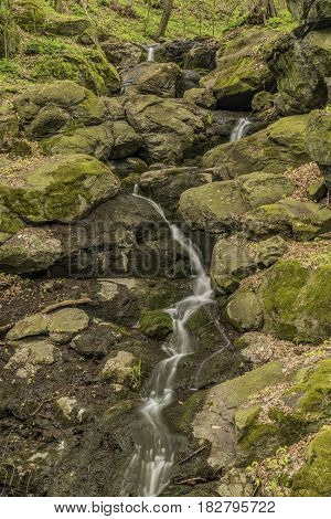Waterfall near Moravany village in spring green day