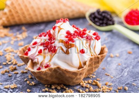 Ice cream with caramel jam, is served with jelly balls