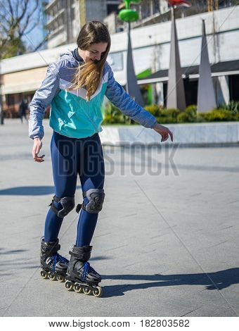 Beautiful Roller Girl is learning how to skate. First time on roller skates.
