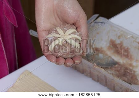 Preparation Of Meat Glomeruli. Stuffed Turkey, Wrapped In Strips Of Puff Pastry. A Woman Winds A Str
