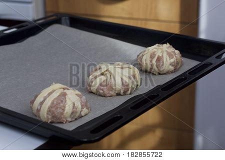 Stages Of Preparation Of Meat Glomeruli. The Blanks Are Laid Out On A Baking Tray Lined With Food Pa