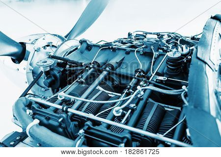 Aircraft engine detail. Piece of equipment of the aircraft engine closeup blue colored. View of an aircraft engine.