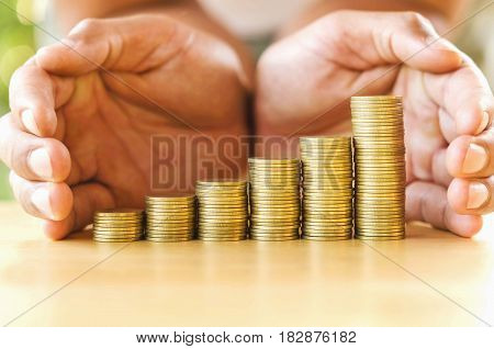 hand save money with stack money coin for growing graph your business