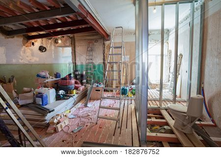 Interior of apartment with materials during on the renovation and construction ( remodel wall from gypsum plasterboard or drywall)