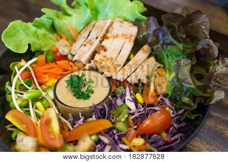 close up of chicken salad with vegetable and tomato