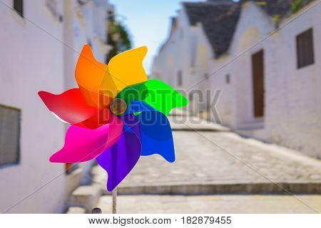 The colorful rainbow pinwheel in sun shine summer day.