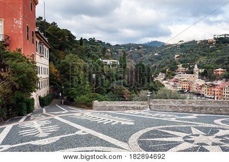 Beautiful square made of small stones at hill of Portofino town, Italy