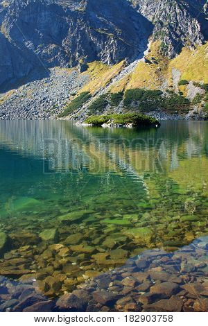 High Tatras in Poland. Lake and monumental peaks. Summer scenic landscape mountain view.