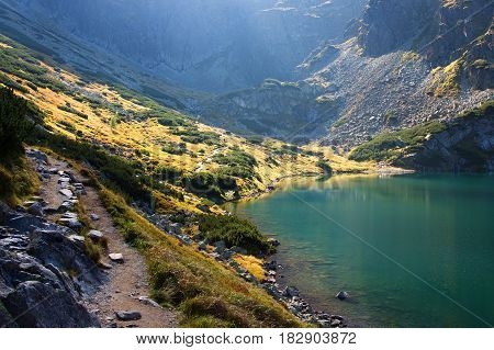 High Tatras in Poland. Lake and monumental peaks. Summer scenic landscape mountain view.