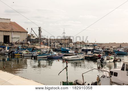 TEL AVIV ISRAEL - May 19 2014: Still functional as a small fishing port - Old Jaffa Port Mediterranean