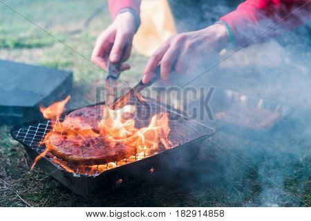 striped mutton steak on non-permanent foil grill closeup