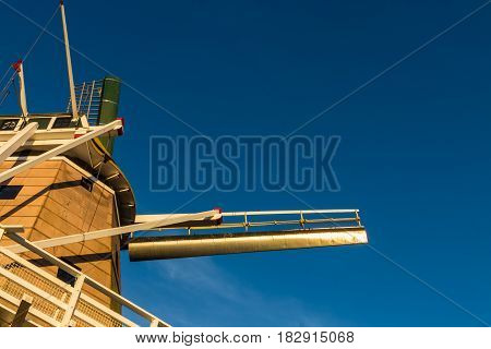 Looking up at Foxton windmill with a blue sky.