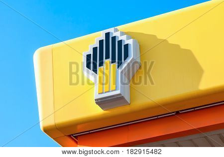 Samara Russia - may 14 2016: Emblem of the oil company Rosneft against the blue sky. Rosneft is one of the largest russian oil companies