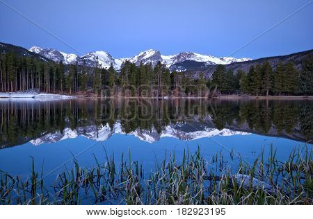 Pre dawn light on the Continental Divide and Sprague Lake located in Rocky Mountain National Park outside of Estes Park Colorado