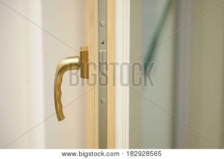 Detail of window handle on wooden window