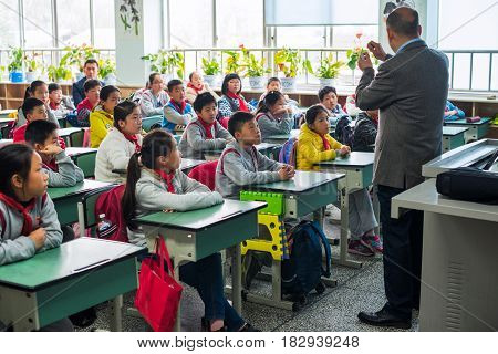 Children And Teacher In A Chinese Classroom