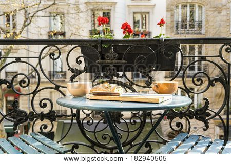 Breakfast on the balcony in Paris, France in springtime
