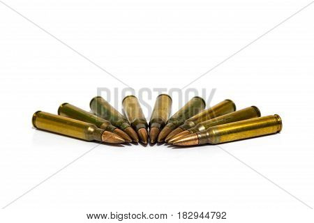 5.56x45mm NATO intermediate cartridges isolated on white background.