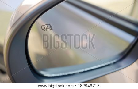 Car rear view mirror heating system .