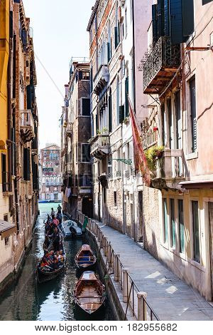 Tourists In Gondolas Little Canal In Venice City