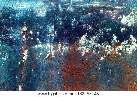 Fragment of old grungy texture with chipped paint and cracks or orange red blue concrete wall and cement surface