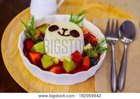 Panda Panna cotta on the table with spoon