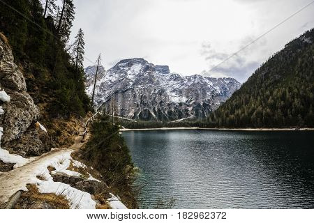 Spring view at Lago Braies, Pragser See Dolomites, Lake mountain landcape with Alps peak reflection , Italy