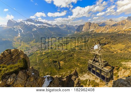 Aerial spring view from Faloria on Cortina Valley and cable car in Dolomites, Italy - Cortina D'Ampezzo at Tondi al Faloria