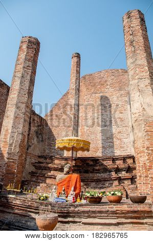 Ancient place at Ayuttha ya Province in Thailand. Wat Mahaeyong with a Buddha statue and Blue sky background