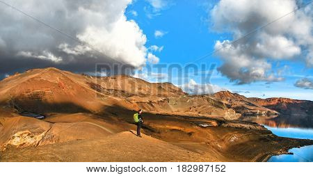 Panoramic View Of Beautiful Geothermal Landscape With Woman Standing On Mountain Top Near Askja Crat