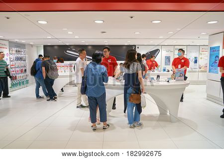 HONG KONG - CIRCA NOVEMBER, 2016: people at SmarTone shop. SmarTone Telecommunications Holdings Limited is a wireless communications carrier with operating subsidiaries in Hong Kong and Macau.