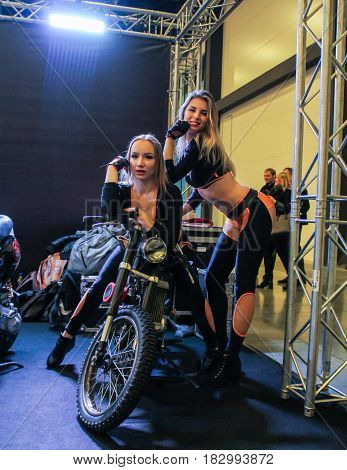 St. Petersburg Russia - 15 April, Fashion models on a motorcycle,15 April, 2017.
International Motor Show IMIS-2017 in Expoforurum.
Models on motorcycles presented at the motor show.