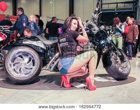 St. Petersburg Russia - 15 April, The girl at the motorcycle,15 April, 2017.
International Motor Show IMIS-2017 in Expoforurum.
Models on motorcycles presented at the motor show.
