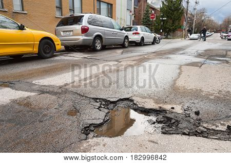 Montreal, Canada - 21 April 2017: Large Unrepaired Pothole On Cartier Street