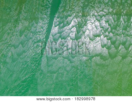 Clear background swimming pool rippled water detail.