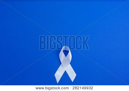 White Color Ribbon For Raising Awareness On Lung Cancer And Multiple Sclerosis And International Day