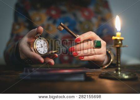 Tarot Cards And A Woman Fortune Teller With A Unravelling Key Of Fate. Future Reading Concept. Divin