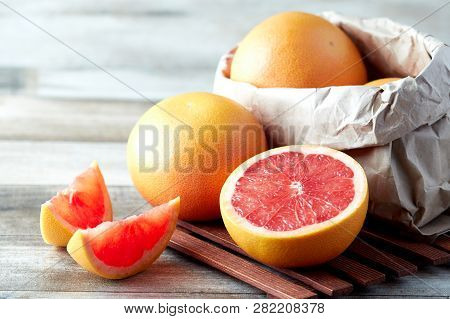 Fresh Raw Grapefruit (citrus X Paradisi) On Wooden Background