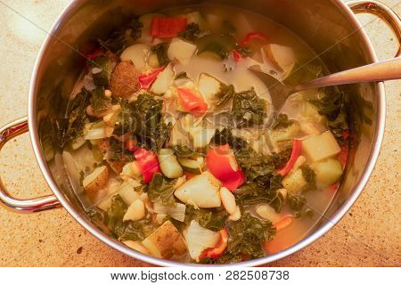A Close-up Shot Of Cooked Healthy Vegetable Soup With Many Nutritious And Tasty Fresh Veggies In A B