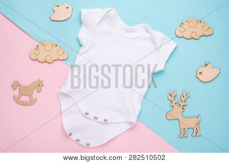 Mockup Flat Lay A White Children's Shirt With Wooden Toys On A Colored Background. Layout For The De