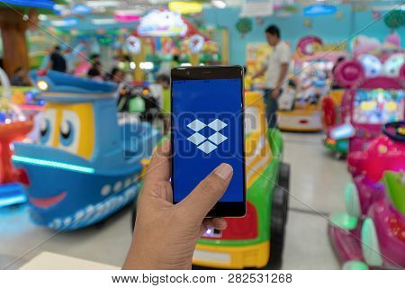 Chiang Mai, Thailand - Jan. 06,2019: Man Holding Huawei With Dropbox On Screen. Dropbox Is A Service