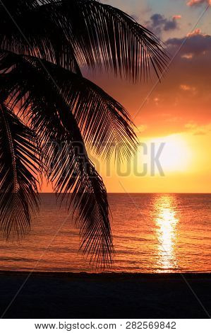 Beautiful Sunset On The Beach, Sun Goes Down To The Sea, Woman Silhouette On The Bayshore. Calm Ambi