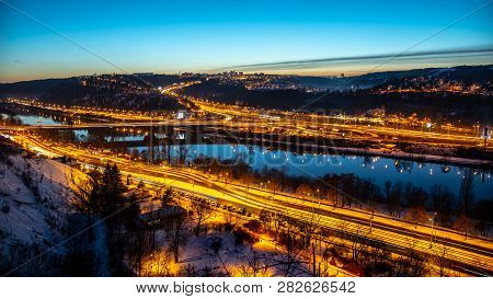 View Of Barrandov Bridge Over Vltava River In Branik, Prague, Czech Republic. Illuminated Roads In C
