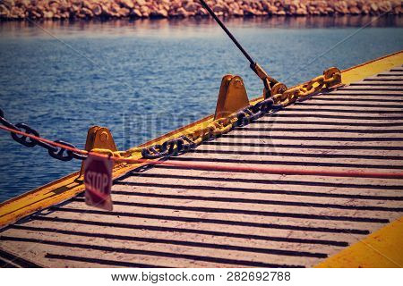 Fragment Of The Big Iron Ladder Of The Sea Vessel Or The Ferry Which Is Spread Out Over Water A Clos
