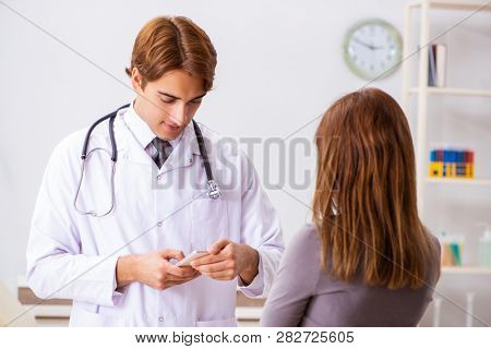 Deaf-mute female patient visiting young male doctor 